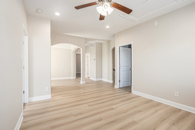 empty room with light hardwood / wood-style flooring and ceiling fan