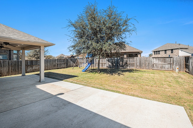 view of yard with a patio area, a playground, and ceiling fan