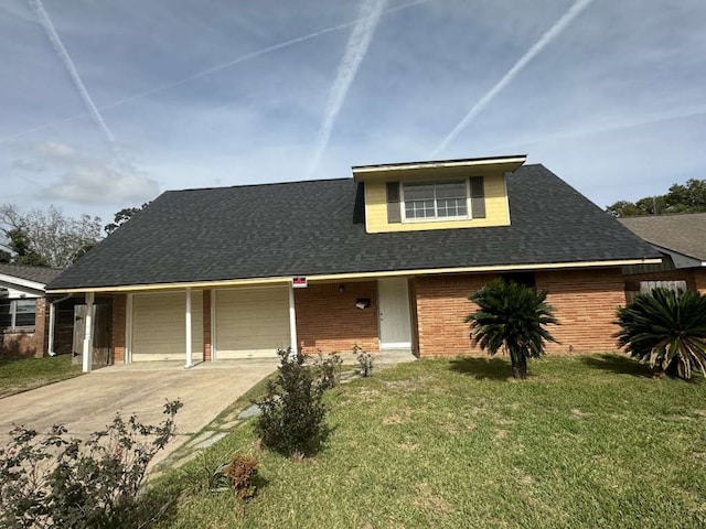 view of front of property with a front yard and a garage