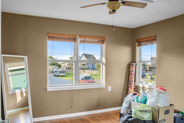 interior space with light wood-type flooring and ceiling fan