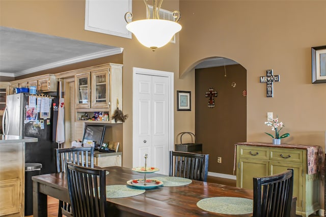 dining room featuring ornamental molding and hardwood / wood-style flooring