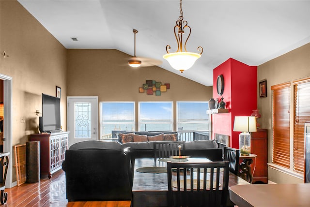 dining area with hardwood / wood-style flooring and lofted ceiling