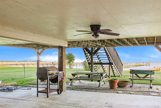 view of patio / terrace with ceiling fan and a grill