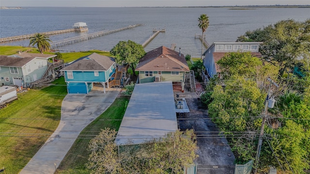 birds eye view of property with a water view