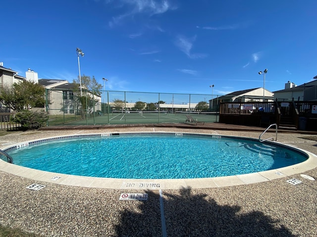 view of pool with a gazebo and tennis court