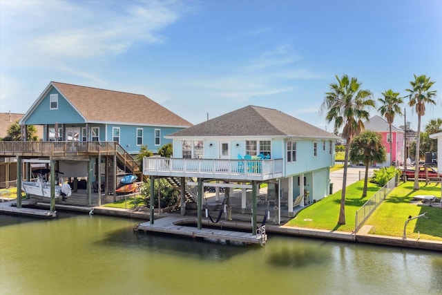 22032 Matagorda Dr, Galveston, TX 77554 - dock area featuring stairway, a deck with water view, and a yard