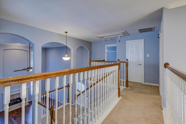 17519 Bighorn River Ln, Humble, TX 77346 - corridor featuring an upstairs landing, attic access, baseboards, and light carpet