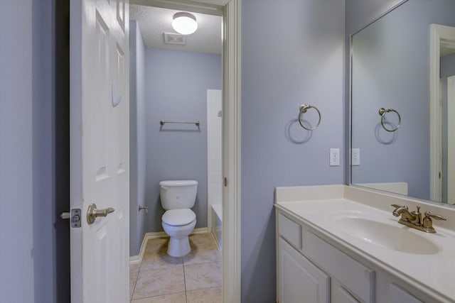 17519 Bighorn River Ln, Humble, TX 77346 - full bath with visible vents, vanity, toilet, baseboards, and tile patterned floors