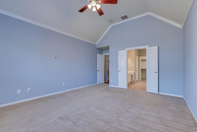 17519 Bighorn River Ln, Humble, TX 77346 - unfurnished bedroom featuring light carpet, vaulted ceiling, baseboards, ornamental molding, and a ceiling fan