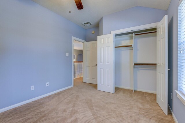 17519 Bighorn River Ln, Humble, TX 77346 - unfurnished bedroom with carpet, a closet, a ceiling fan, baseboards, and lofted ceiling