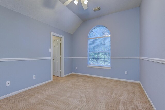 17519 Bighorn River Ln, Humble, TX 77346 - spare room with ceiling fan, carpet floors, vaulted ceiling, and baseboards