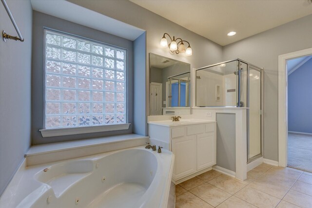 17519 Bighorn River Ln, Humble, TX 77346 - bathroom featuring a shower stall, vanity, a tub with jets, tile patterned floors, and healthy amount of natural light