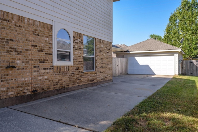 17519 Bighorn River Ln, Humble, TX 77346 - view of side of property featuring concrete driveway, brick siding, fence, and a garage