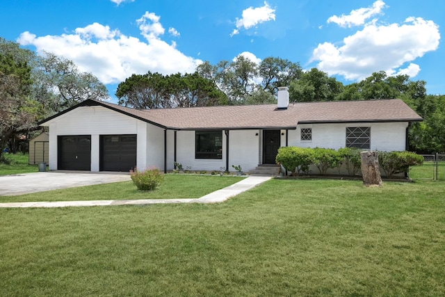 single story home featuring a garage and a front yard