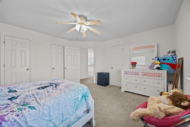 bedroom featuring ceiling fan and light carpet