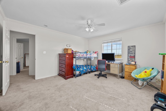 office space featuring ceiling fan, ornamental molding, and light colored carpet