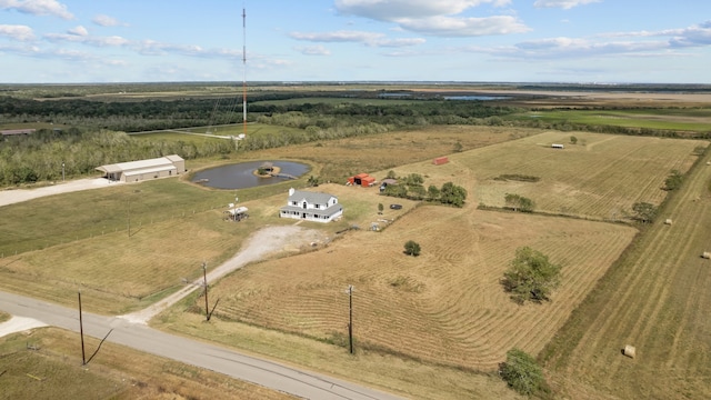 birds eye view of property with a rural view