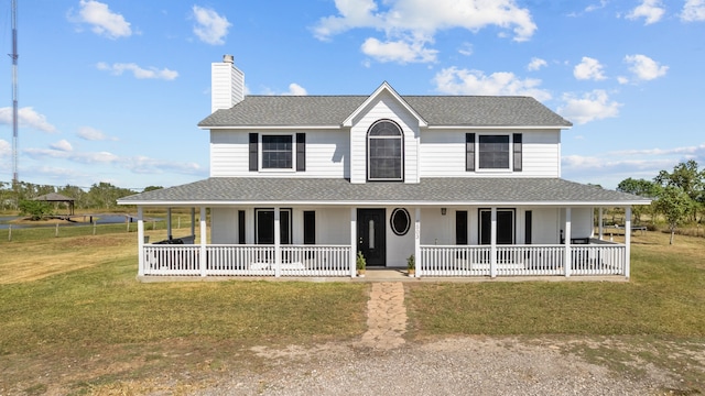 farmhouse-style home with a porch and a front lawn