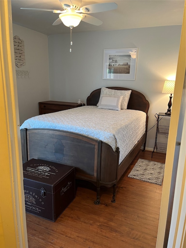 bedroom featuring ceiling fan and hardwood / wood-style floors