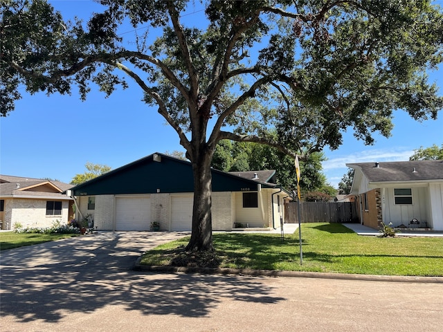 view of front facade with a garage and a front yard