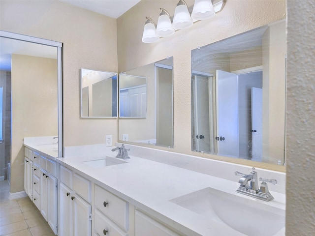 bathroom with vanity and tile patterned flooring