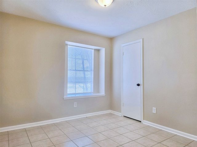 empty room with light tile patterned floors