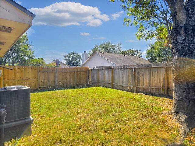 view of yard featuring central air condition unit