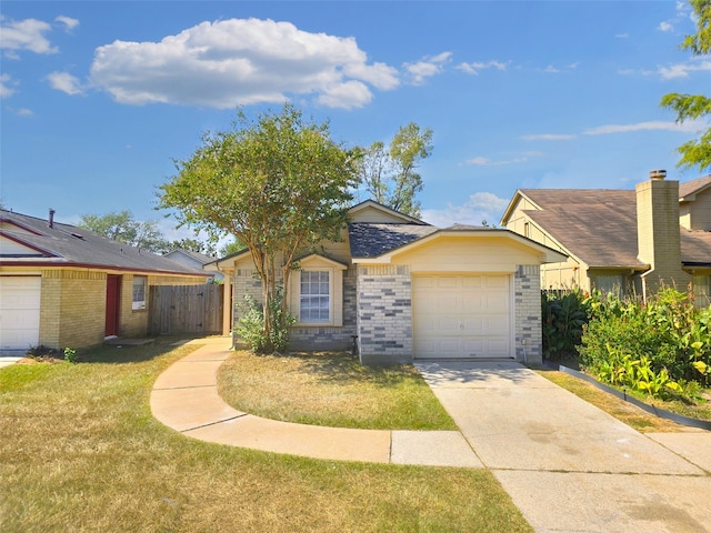 ranch-style home featuring a front yard and a garage