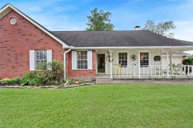 ranch-style home with a porch and a front yard