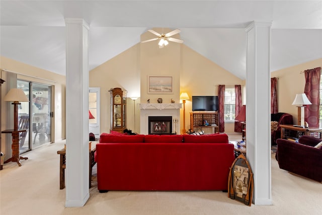 living room featuring light colored carpet, high vaulted ceiling, and plenty of natural light