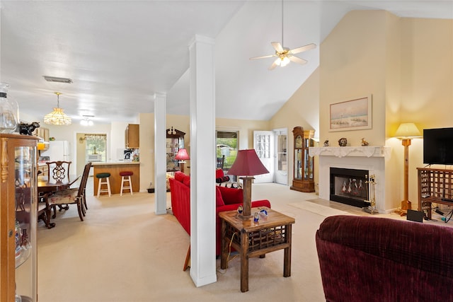 living room featuring light carpet, high vaulted ceiling, and a healthy amount of sunlight