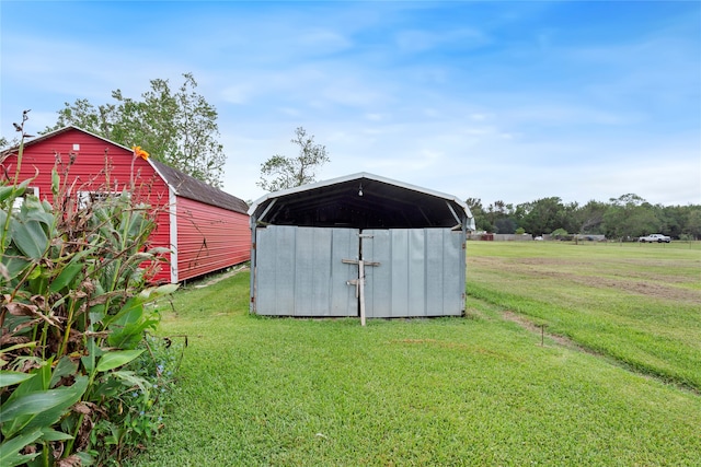 view of outdoor structure with a lawn