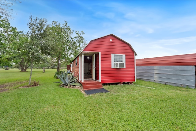 view of outbuilding with a lawn