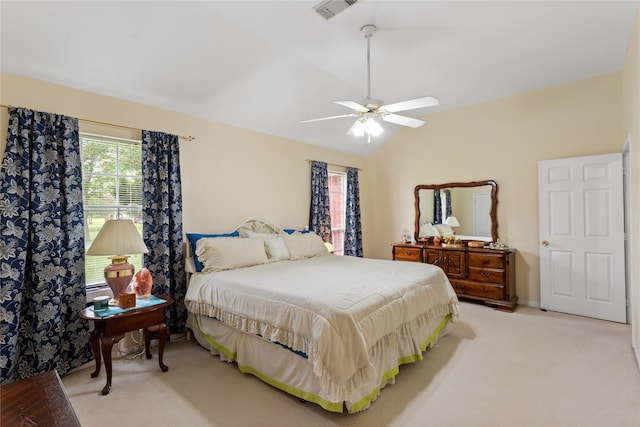 carpeted bedroom with lofted ceiling and ceiling fan