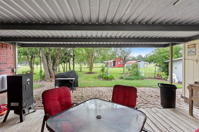 deck featuring a patio area and a lawn