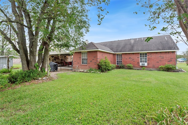 back of property featuring a yard