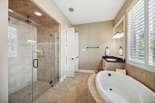 bathroom with separate shower and tub, tile patterned flooring, and vanity