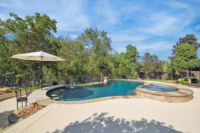 view of swimming pool with an in ground hot tub and a patio