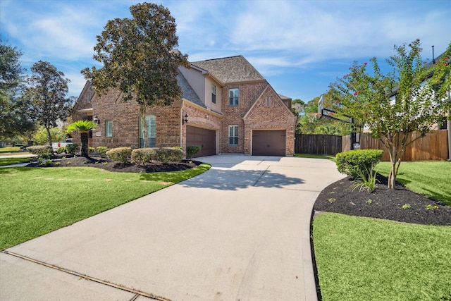 view of front facade with a garage and a front lawn