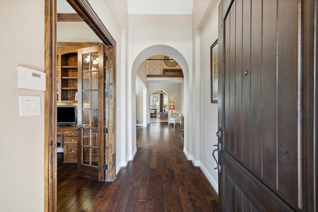 corridor with dark hardwood / wood-style floors