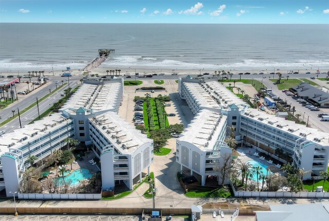 6102 Seawall Blvd Unit 161, Galveston, TX 77551 - drone / aerial view of a pool and expansive beach