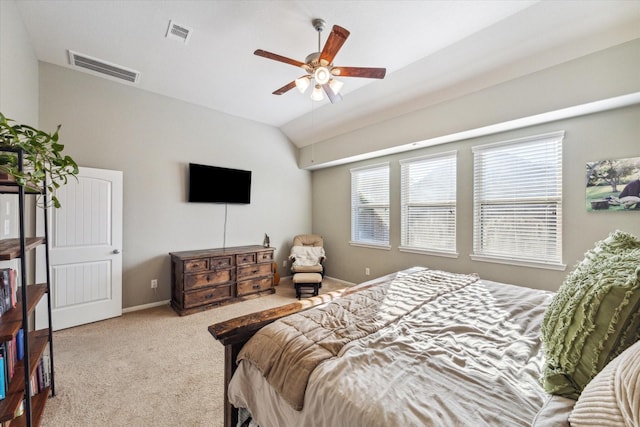 carpeted bedroom featuring ceiling fan and vaulted ceiling