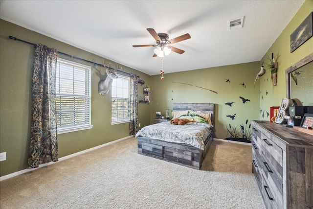 bedroom featuring ceiling fan and light colored carpet