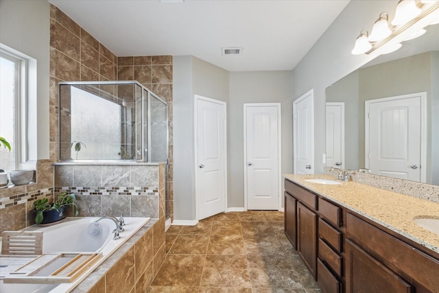 bathroom featuring tile patterned flooring, vanity, and independent shower and bath