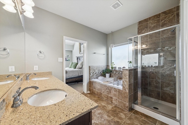 bathroom featuring tile patterned floors, vanity, and shower with separate bathtub