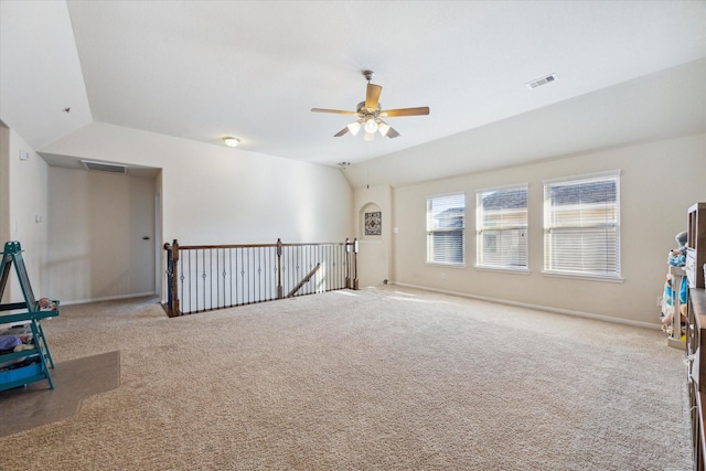 recreation room with light carpet, ceiling fan, and lofted ceiling