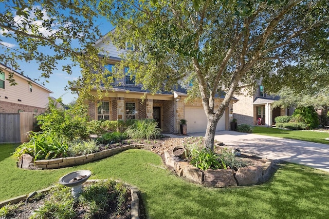 view of front of property with a front yard and a garage