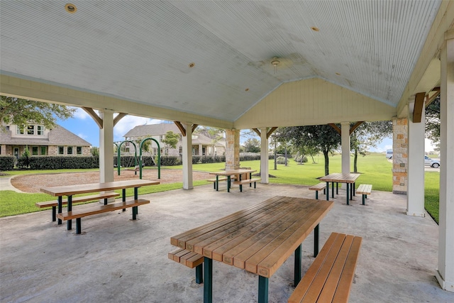 view of property's community featuring a patio area and a yard