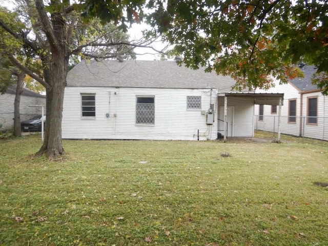 rear view of house with a yard