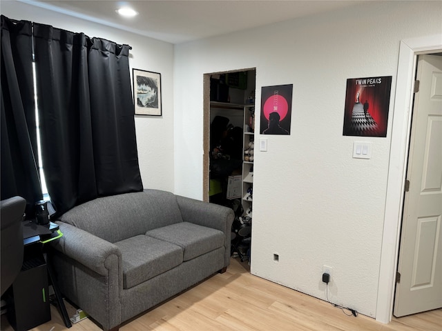 living area with light hardwood / wood-style flooring